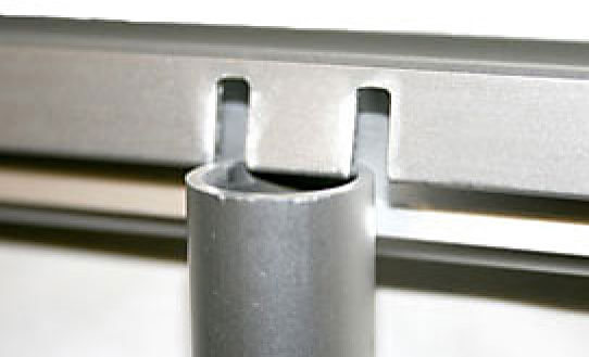 A detail shot of the aluminium top rail of a roll-up banner being clipped to the vertical pole