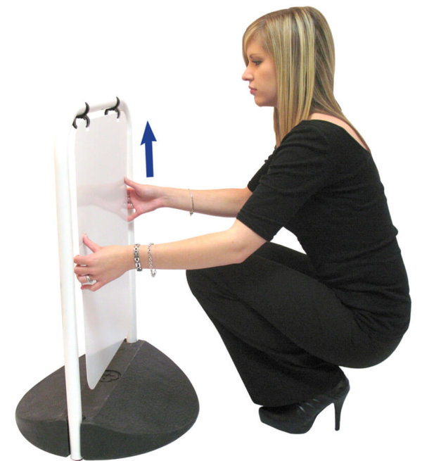 A photo of a woman removing the panel from an Eco-Swing pavement swing sign