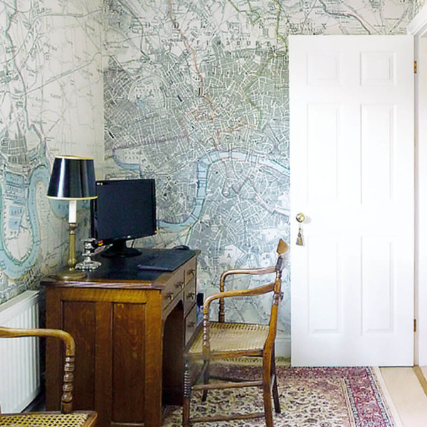 A room wrapped in a vintage London map using custom wallpaper from Print 2 Media