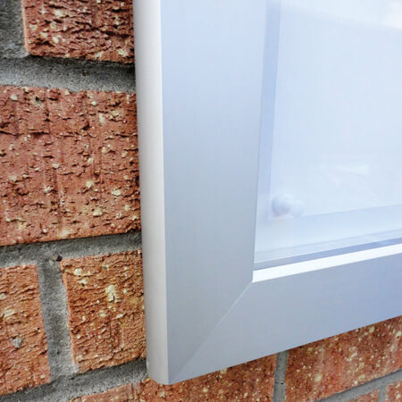 Image of the mitred corner f the anodised aluminium frame of the illuminated menu display case