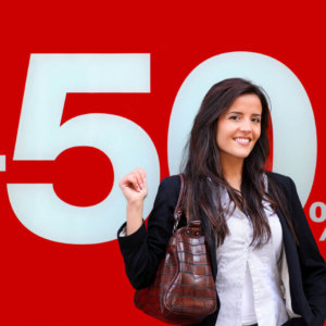 A picture of a lady stood in front of a large format printed card POS sign