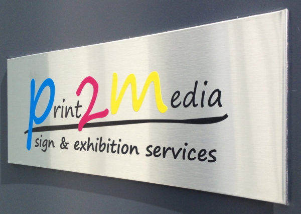 Picture showing a sign printed on butler finish brushed aluminium sheet